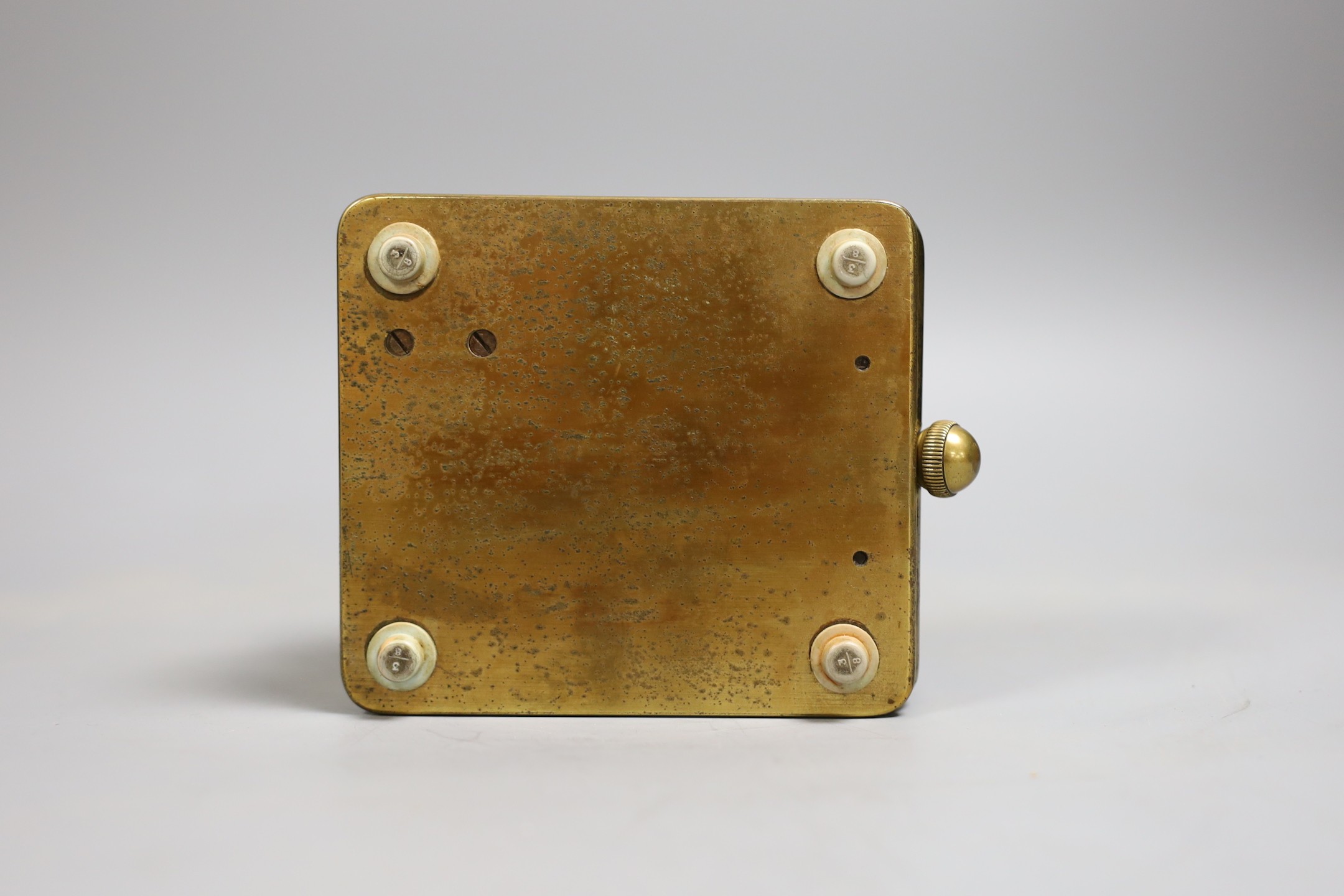 An Omega brass cased nautical deck timepiece with winding key, serial number 9566247